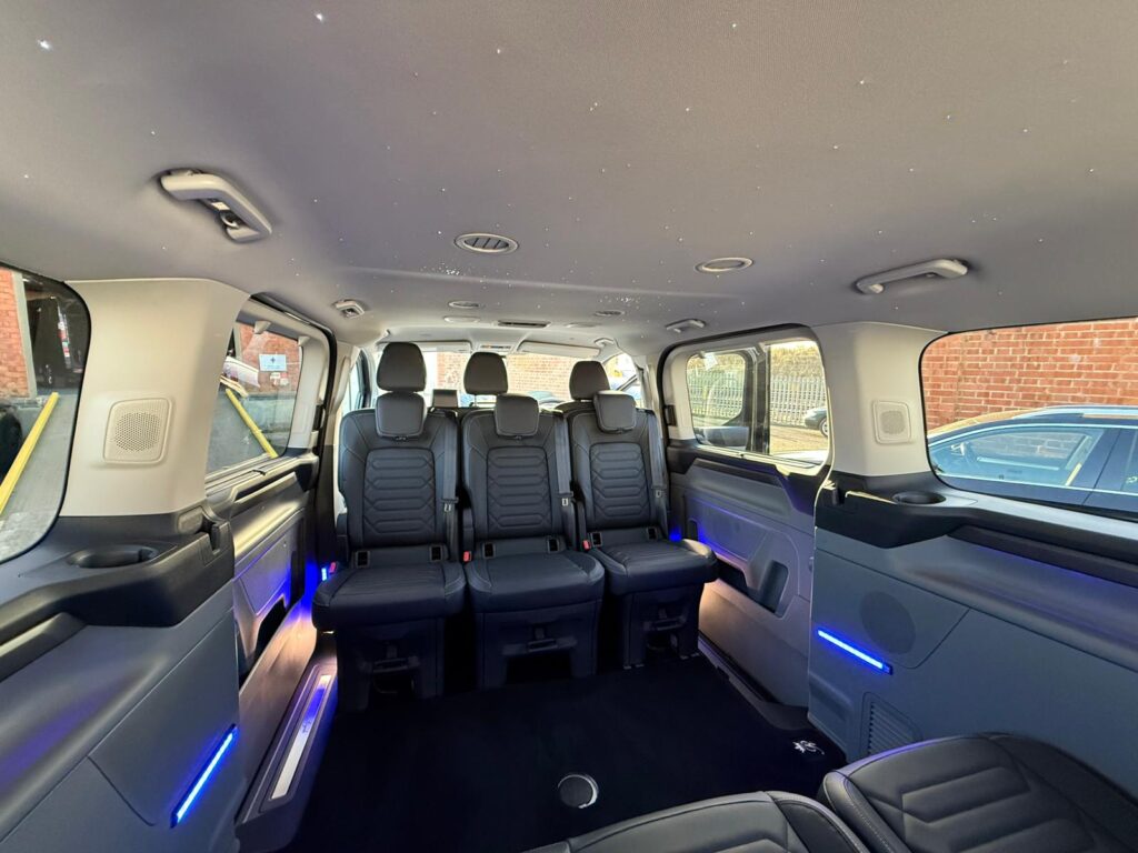 The interior of a minibus with LED lighting